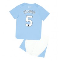 Camiseta Manchester City John Stones #5 Primera Equipación para niños 2023-24 manga corta (+ pantalones cortos)